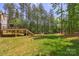 Spacious backyard with a large deck and lush green lawn at 545 Morrison Farm Rd, Troutman, NC 28166