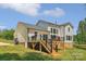 Charming backyard featuring a spacious deck perfect for outdoor entertaining and enjoying the serene surroundings at 545 Morrison Farm Rd, Troutman, NC 28166