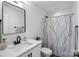 Bathroom featuring a vanity, modern faucet, a decorative shower curtain, and a mirror at 545 Morrison Farm Rd, Troutman, NC 28166