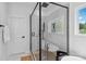 Bathroom featuring a glass-enclosed shower and soaking tub with natural light at 545 Morrison Farm Rd, Troutman, NC 28166