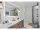 Modern bathroom with double vanity, sleek fixtures, and a glass-enclosed shower at 545 Morrison Farm Rd, Troutman, NC 28166
