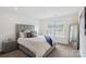 Bedroom with neutral walls, large bed, a window, and stylish bedside table at 545 Morrison Farm Rd, Troutman, NC 28166