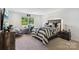 Bedroom with a desk, ample natural light, and a decorative, well-styled bed at 545 Morrison Farm Rd, Troutman, NC 28166