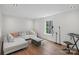 Living room with hardwood floors, a window, couch, and music stand at 545 Morrison Farm Rd, Troutman, NC 28166