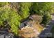 Aerial view of a lovely home with mature trees and a green lawn at 551 Belfast Dr, Gastonia, NC 28052
