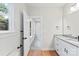 Well-lit bathroom with granite countertops, matte black hardware, and view to another room at 551 Belfast Dr, Gastonia, NC 28052