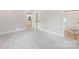 Neutral bedroom with closet, access to a bathroom, and soft gray carpet flooring at 551 Belfast Dr, Gastonia, NC 28052