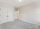 Spacious carpeted bedroom shows ample closet space and an adjacent doorway, adding convenience to the space at 551 Belfast Dr, Gastonia, NC 28052