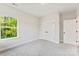 Neutrally painted bedroom features a large closet, and plush carpet that enhances comfort and style at 551 Belfast Dr, Gastonia, NC 28052