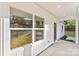 Exterior view of a bright house with a cozy patio and a lush green lawn at 551 Belfast Dr, Gastonia, NC 28052