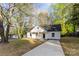 Beautiful white home with a welcoming front porch and a long, paved driveway at 551 Belfast Dr, Gastonia, NC 28052