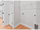 The laundry area features a wire rack shelf, wood flooring, and a utility sink hookup at 551 Belfast Dr, Gastonia, NC 28052