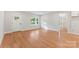 Bright living room featuring hardwood floors, a large window, and a front door, perfect for entertaining guests at 551 Belfast Dr, Gastonia, NC 28052