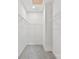 Walk-in closet has carpet flooring, a ceiling light, and metal shelving at 551 Belfast Dr, Gastonia, NC 28052
