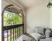 Cozy covered balcony features brick archway and tiled flooring, perfect for relaxation and enjoying the view at 5807 Sharon Rd # A, Charlotte, NC 28210