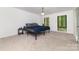 Spacious bedroom with two windows and plush carpeting at 5807 Sharon Rd # A, Charlotte, NC 28210