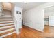 Foyer with hardwood floors and traditional trim leading to other parts of the house at 5807 Sharon Rd # A, Charlotte, NC 28210