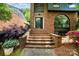 Brick staircase leading to the front door, complemented by well-kept landscaping and colorful flowers at 5807 Sharon Rd # A, Charlotte, NC 28210