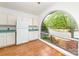 Kitchen nook with an arched window overlooking the yard at 5807 Sharon Rd # A, Charlotte, NC 28210