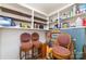 Well-organized pantry with wooden shelves and lots of storage space, maximizing kitchen organization and efficiency at 5807 Sharon Rd # A, Charlotte, NC 28210