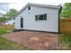 The rear of the home displays a brick patio and access to the backyard at 601 Whisnant St, Shelby, NC 28150