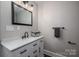 Modern bathroom with a sleek vanity, marble countertop, and contemporary fixtures at 601 Whisnant St, Shelby, NC 28150