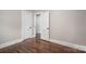 Bedroom with hardwood floors and doorways to other rooms at 601 Whisnant St, Shelby, NC 28150