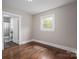 Bedroom with hardwood floors, window and door to bathroom at 601 Whisnant St, Shelby, NC 28150