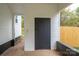 This covered patio features a small brick retaining wall at 601 Whisnant St, Shelby, NC 28150