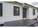 Charming front porch with a dark painted surface, providing a warm welcome to the home at 601 Whisnant St, Shelby, NC 28150