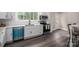 Charming kitchen with white cabinets, stainless steel appliances, and a view from the window at 601 Whisnant St, Shelby, NC 28150