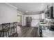 Open kitchen layout with stainless steel appliances and a breakfast bar area at 601 Whisnant St, Shelby, NC 28150