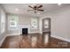 Inviting living room featuring a fireplace, gleaming hardwood floors and natural light at 601 Whisnant St, Shelby, NC 28150