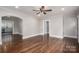 Spacious living room showcasing hardwood floors, neutral paint and easy access to other rooms at 601 Whisnant St, Shelby, NC 28150