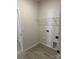 Practical laundry room space with hookups and shelving at 6333 Honor Ave, Midland, NC 28107