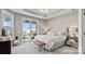 Serene bedroom features a sliding glass door with bench seating, and soft, neutral decor at 8105 Stillhouse Ln # 23, Harrisburg, NC 28075