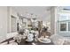 Open-concept space features a dining area with table decor near the kitchen and living areas at 8105 Stillhouse Ln # 23, Harrisburg, NC 28075