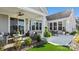 Outdoor patio with seating, greenery, and a view of the well-maintained backyard at 8105 Stillhouse Ln # 23, Harrisburg, NC 28075