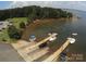 Aerial view showcases boat ramps and boat docks with lush trees surrounding the lake at 8210 Lantana Dr, Denver, NC 28037