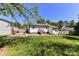 Back of home featuring a wooden deck and a spacious backyard at 8210 Lantana Dr, Denver, NC 28037