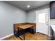 Cozy breakfast nook with custom wood bench seating, a built-in table, and natural light at 8210 Lantana Dr, Denver, NC 28037