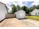 Detached garage with a concrete driveway, located next to a fenced-in yard at 8210 Lantana Dr, Denver, NC 28037