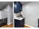 Breakfast bar with custom blue cabinets and subway tile at 8210 Lantana Dr, Denver, NC 28037