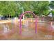 A water park offers Gathering fun in this splash pad area with various water features and green spaces at 8210 Lantana Dr, Denver, NC 28037