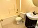 Standard bathroom featuring tile flooring and a vanity with a sink at 8608 Warwick Crest Ln, Charlotte, NC 28215