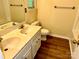 Bathroom featuring dual sinks, cabinets, and a toilet at 8608 Warwick Crest Ln, Charlotte, NC 28215