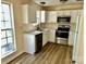 Modern kitchen featuring stainless steel appliances, stylish countertops, and ample cabinet space at 8608 Warwick Crest Ln, Charlotte, NC 28215