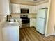 Well-equipped kitchen with stainless steel appliances, quartz countertops, and white cabinetry at 8608 Warwick Crest Ln, Charlotte, NC 28215