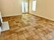 Living room featuring tile floors and a cozy fireplace and leading to a patio through glass doors at 8608 Warwick Crest Ln, Charlotte, NC 28215