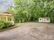 View of the back of the property, which includes a gazebo and a shed at 905 Mount Olivet Rd, Kannapolis, NC 28083